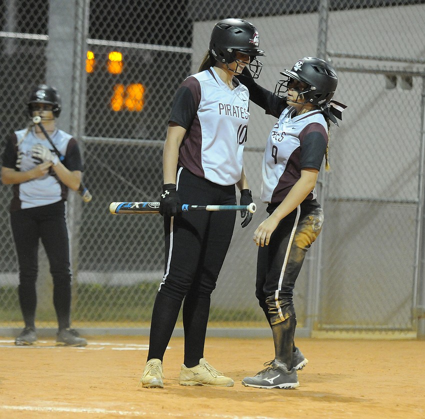 Brooke Farrow and Myah Moy congratulate one another after Braden River took an early 1-0 lead.