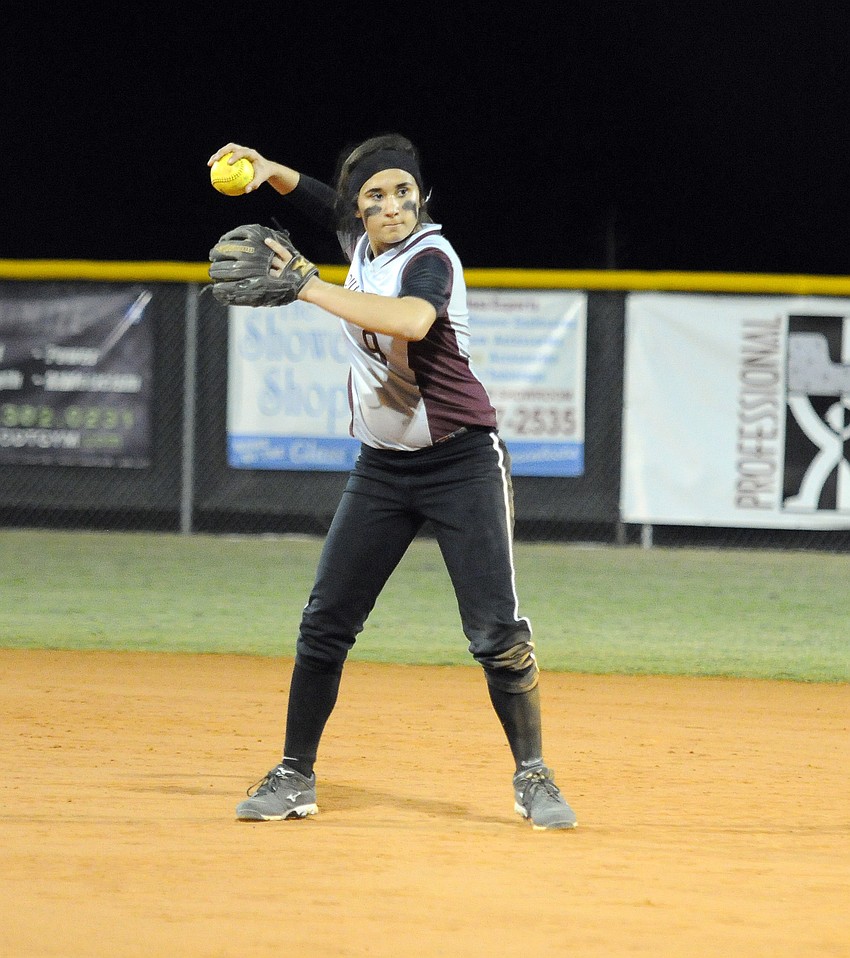 Braden River junior second baseman Myah Moy tosses the ball back to first base.