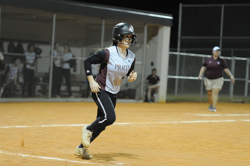 Senior Kally Martin heads down to first base after drawing a walk.