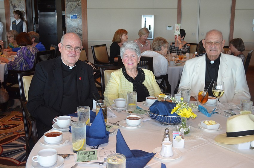 Msgr. Gerry Finegan, Women’s Guild President Eileen Hassel and the Rev. Edward Pick