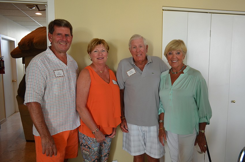 Event co-chairperson John and Jan Marshall with Buddy and co-chairperson Nancy Bronska