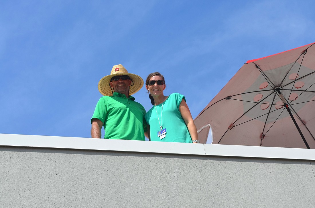 Freedom Elementary Principal Jim Mennes and Assistant Principal Laura Campbell spent St. Patrick's Day on the roof.