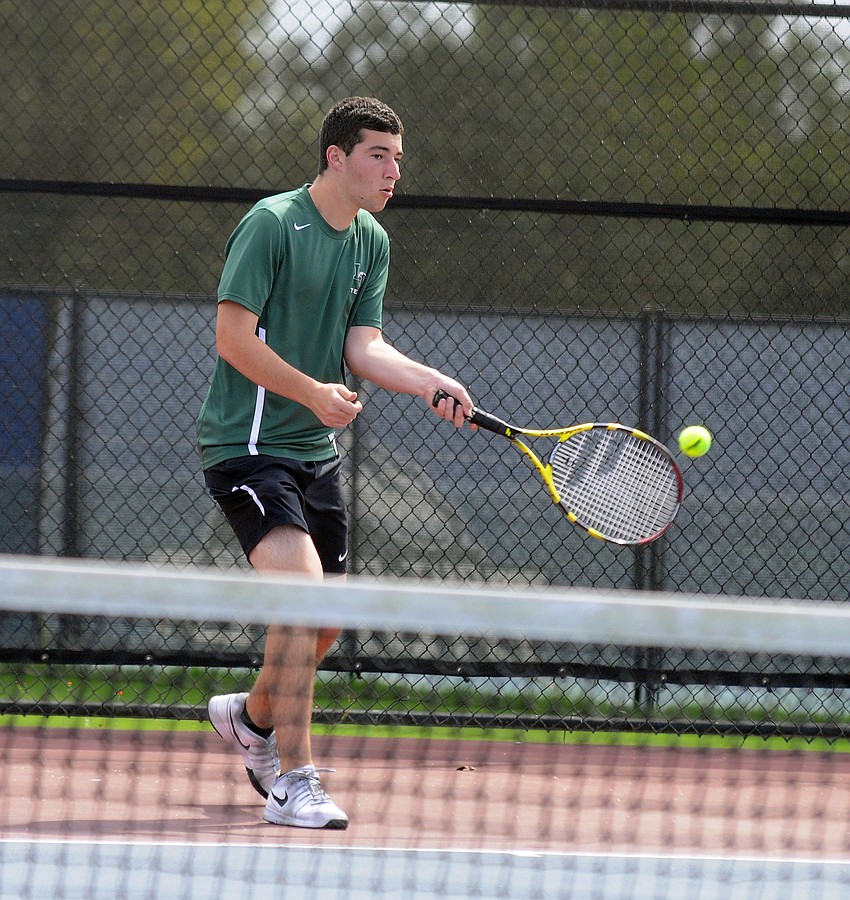 Lakewood Ranch junior Joseph Burton hits the ball during his No. 5 singles match.