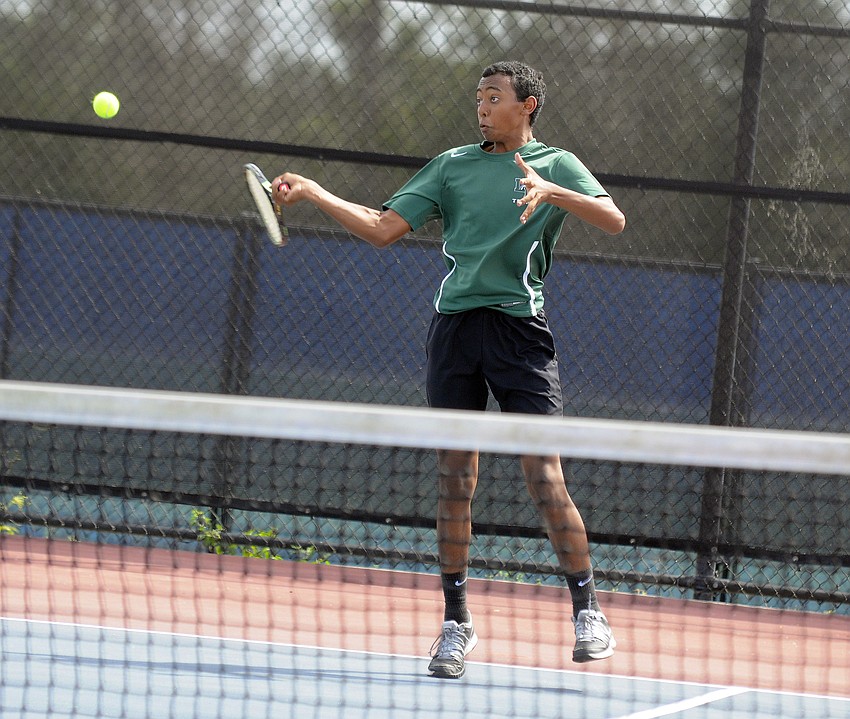 Lakewood Ranch freshman Philip Pugh returns a serve during his No. 4 singles match March 17.