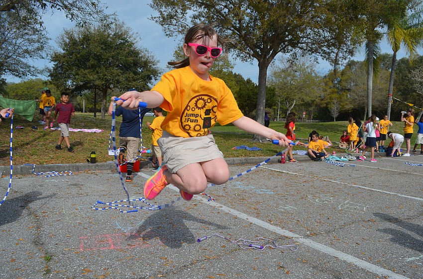 Second-grader Samantha Berry jumps as high as she can.