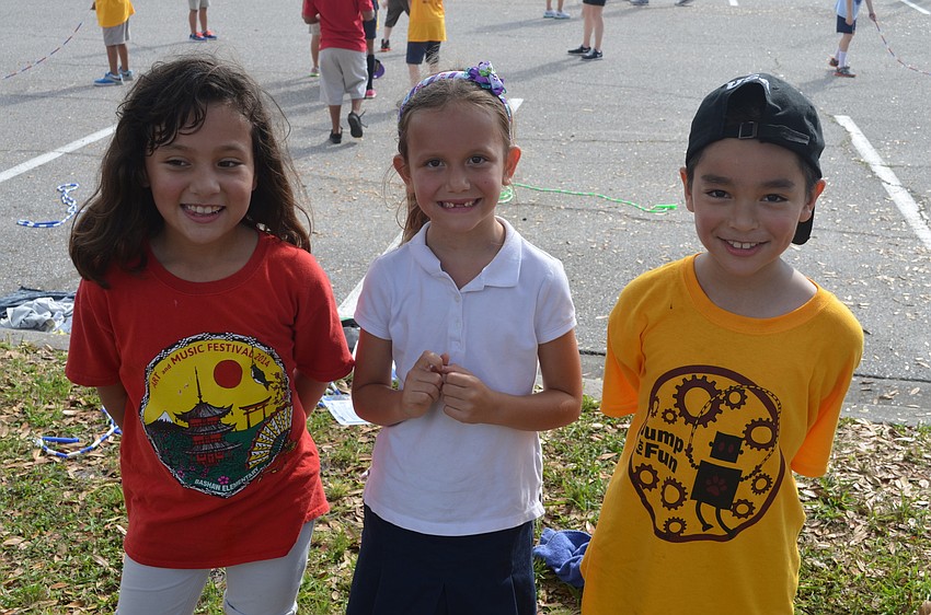Lisa Aguitera, Kai Gill and Isai Palacios take a break from jumping rope.