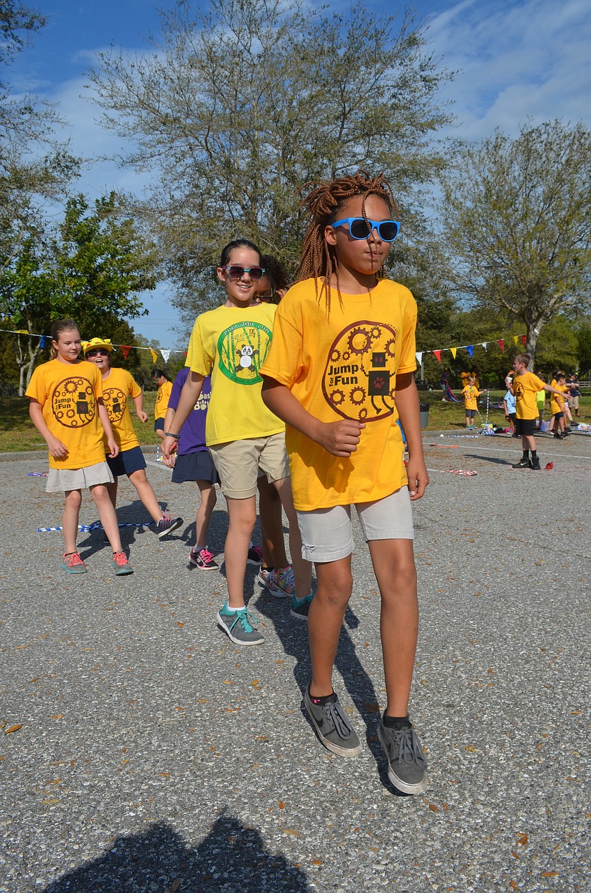 Fifth-grader Raney Rhyne dances to the 