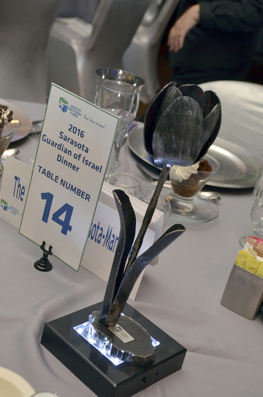 Hand sculpted roses crafted from Kassam rockets that have been fired into Southern Israel by Gaza terrorists were used as centerpieces at the event. The art symbolizes the perseverance of the people of Israel.