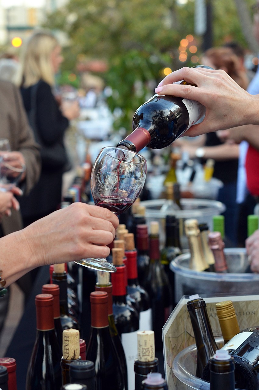 Guests enjoyed a wine tasting before being seated for dinner at Banquet on the Block.