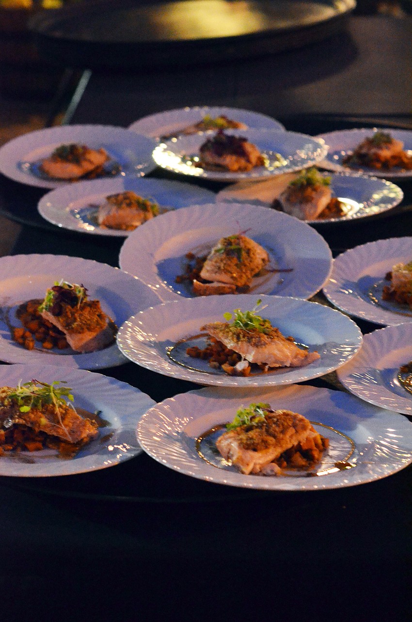 Second Course — Apricot & Mustard Glazed Roast Salmon, sweet potato, butternut squash, tasso ham hash, gingerbeer gastrique prepared by Nils Tarantik, Duval's New World Cafe