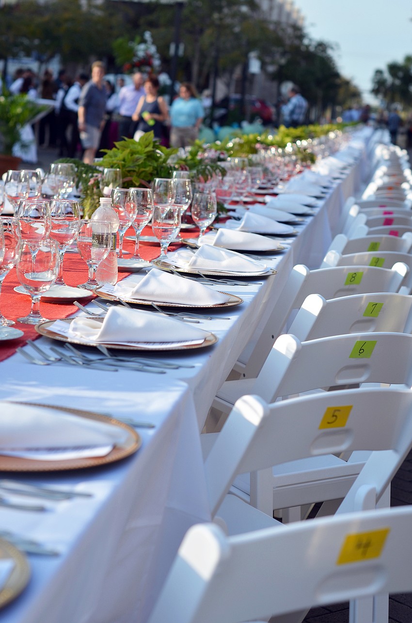 Guests enjoy a dinner on Lemon Avenue for Florida Winefest and Auction's Banquet on the Block.