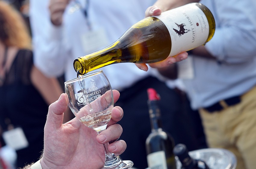 Guests enjoyed a wine tasting before being seated for dinner at Banquet on the Block.