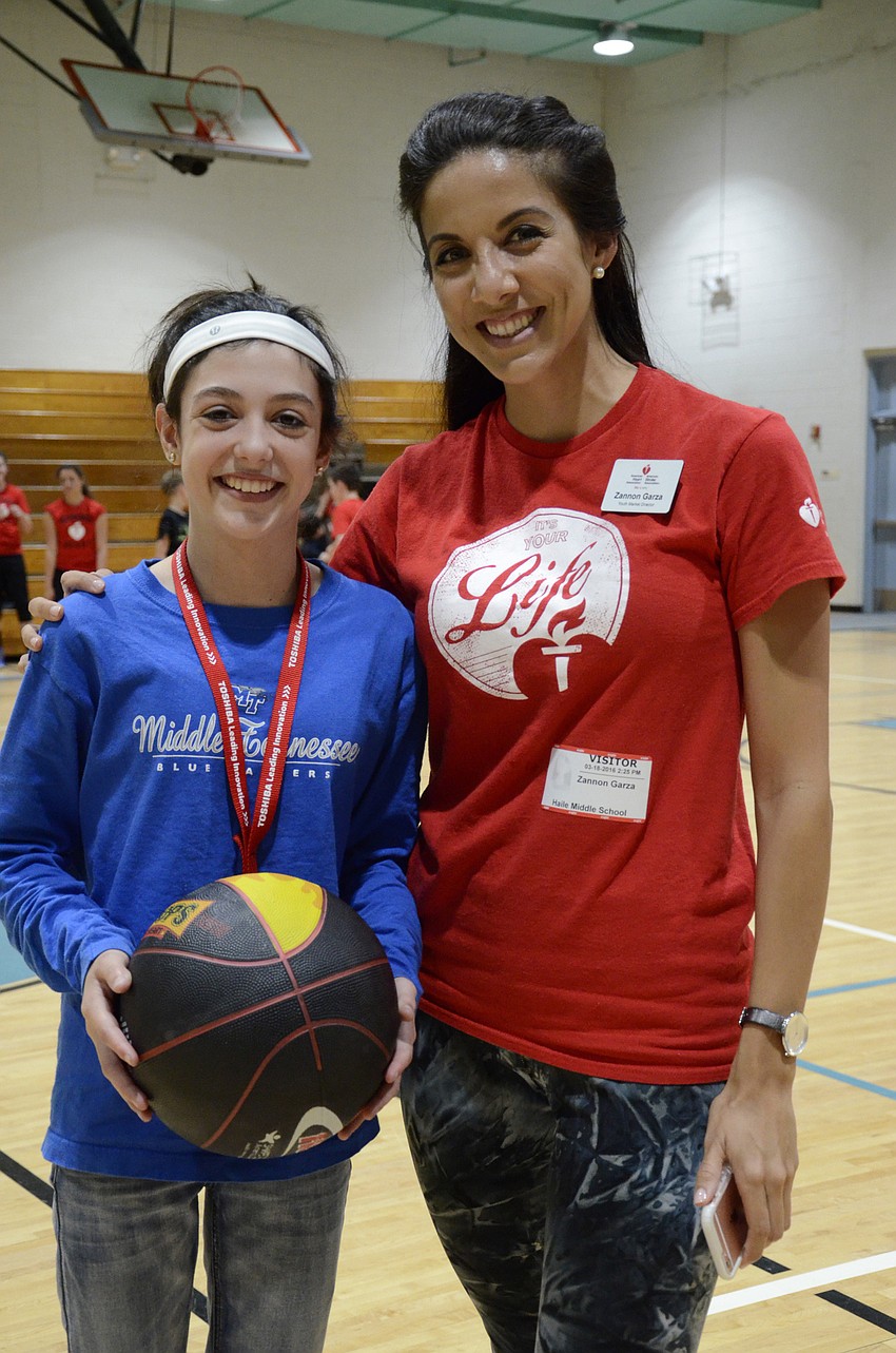 Riley Holton with Zannon Garza, Youth Marketing Director with American Heart Association. Holton was the top donator, giving $100 to the fundraiser.
