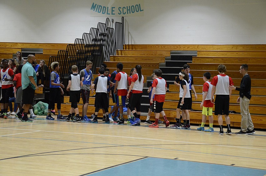 The top teams shake hands after their game.