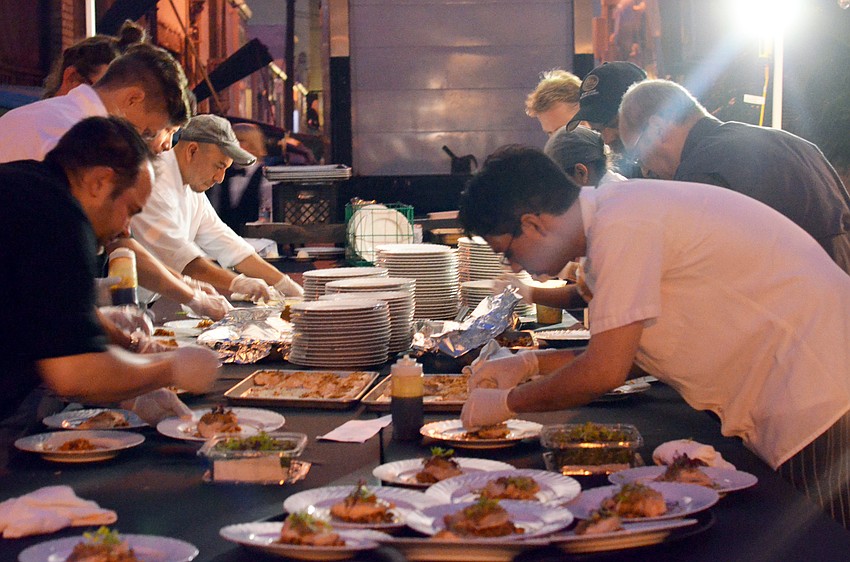 The second course is prepared while guests enjoy the first.
