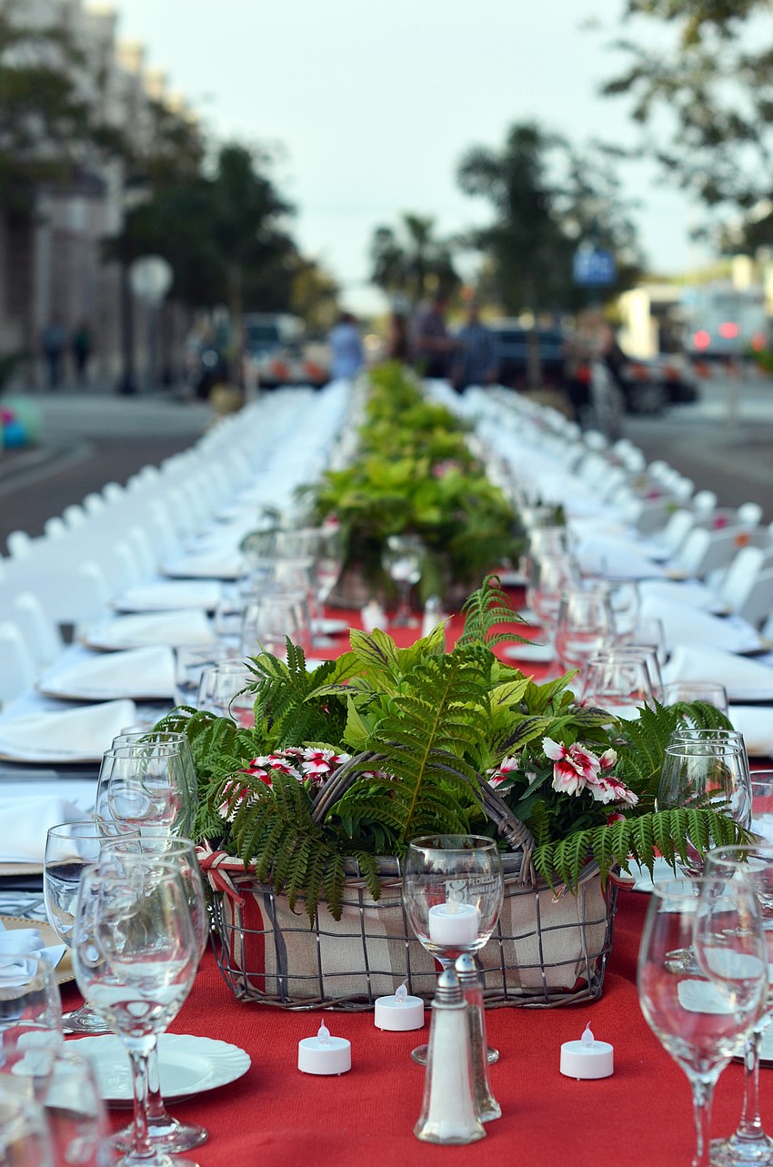 Guests enjoy a dinner on Lemon Avenue for Florida Winefest and Auction's Banquet on the Block.