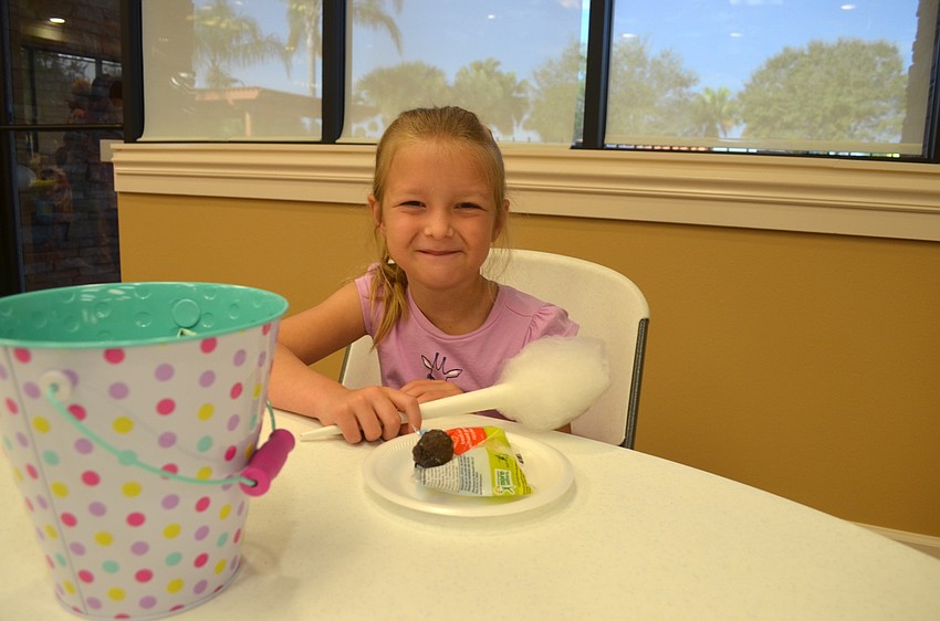 Lenuca Gore snacks on sweet treats.