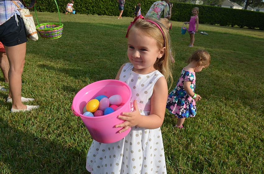 Alice Gustek shows her mom her winnings.