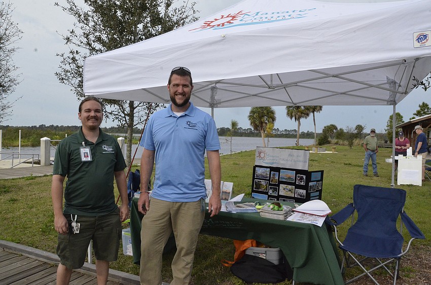 Aedan Stockdale and Cary Catts of the Manatee County Parks and Natural Resources department helped run the festival Saturday morning.