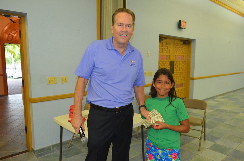 Congressman Vern Buchanan and 50/50 raffle winner Isabelle Wright, 10