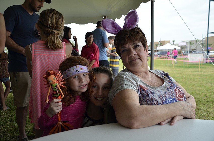 Evalyn and Emma Adams with their grandma, Melody Hawkins, all of Sarasota.