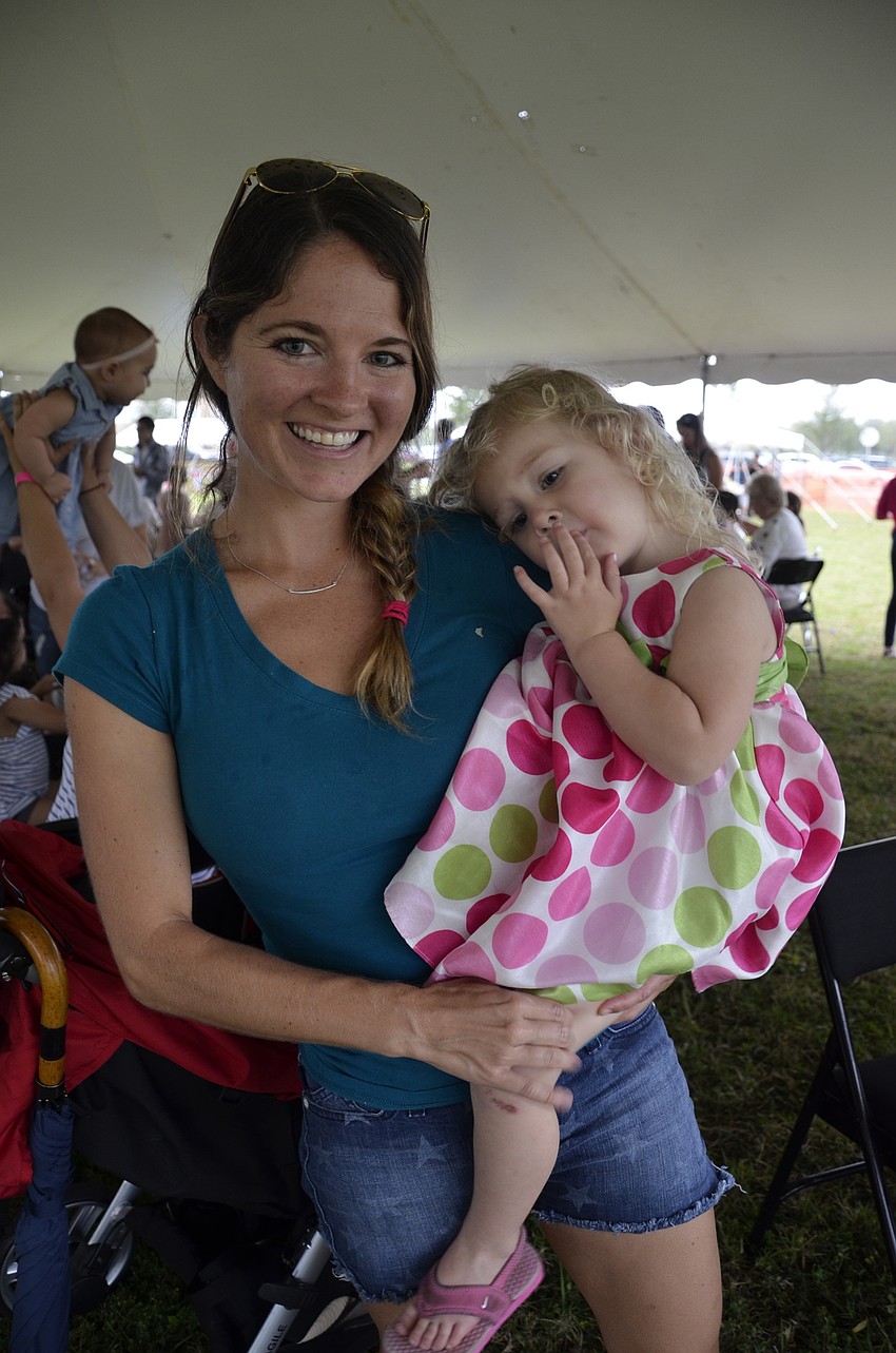 Annabel and Ashley Beasley of Parrish wait out the rain. 