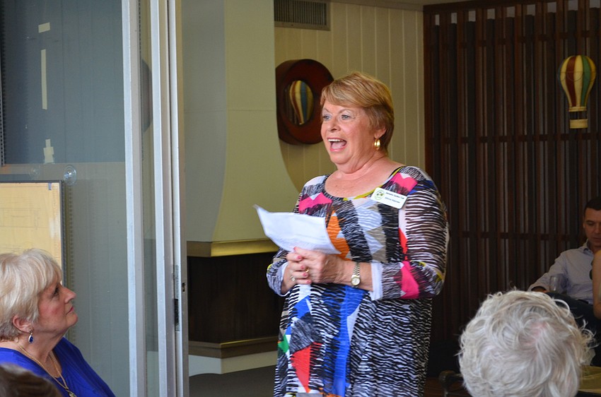 Sarasota Garden Club President Olivia Haynes welcomes guests to the Twitchell House on Siesta Key.
