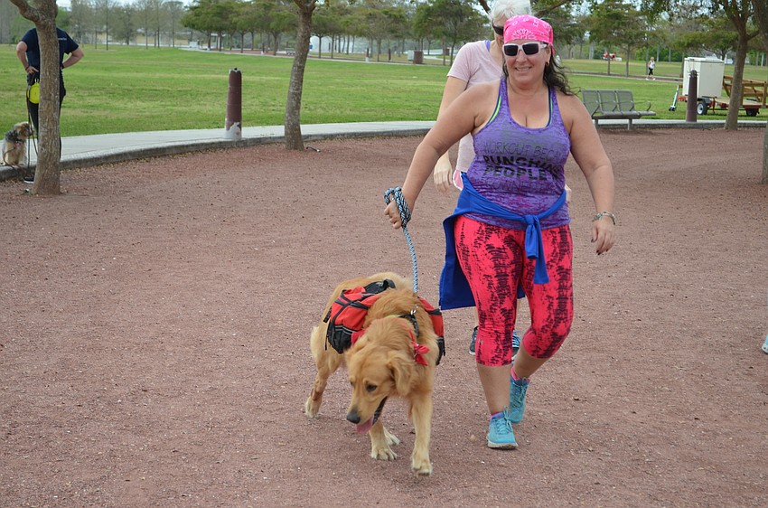 Kathy Martin and Boca start their first lap of the Walkathon.