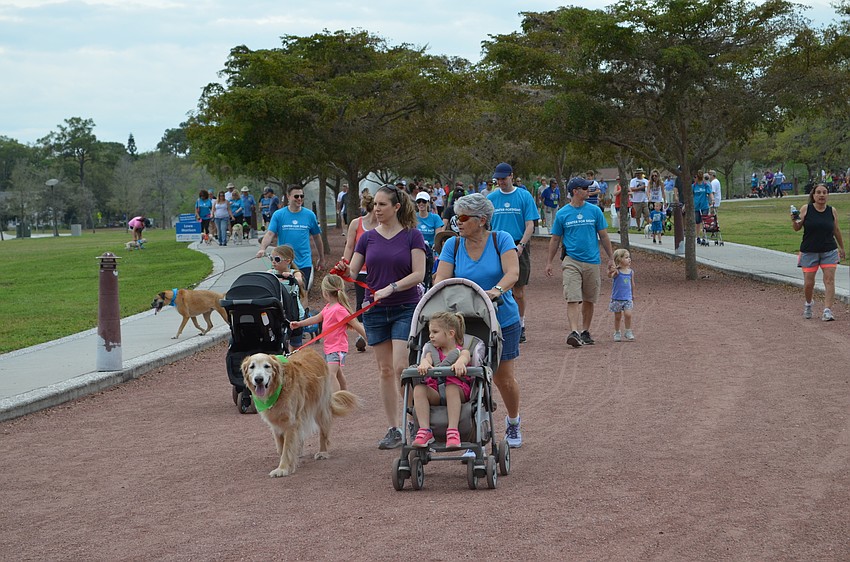 Residents took laps around Payne Park Saturday morning for the Southeastern Guide Dogs Walkathon.
