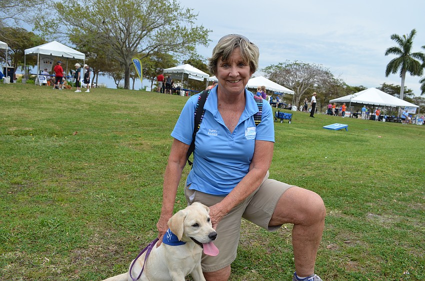 Southeastern Guide Dogs Puppy Raiser Terry Kersey with four-month-old Zoe.