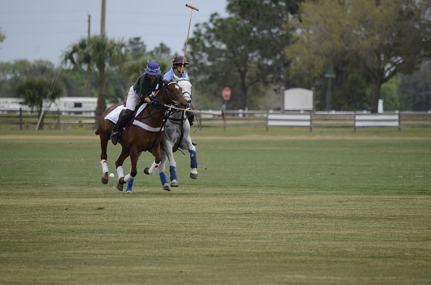 Morgan Bowman on the Polo Grill team protects the ball from her opponent.
