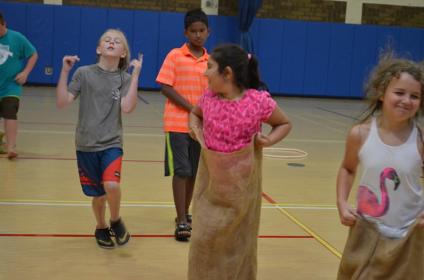 Games included sack races in the gymnasium.