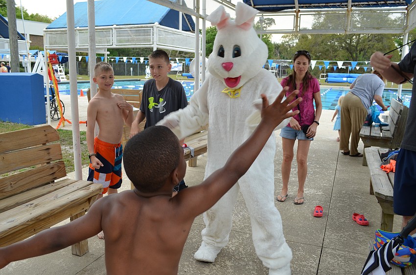 Tyron Mannings teaches the Easter bunny how to dance the 