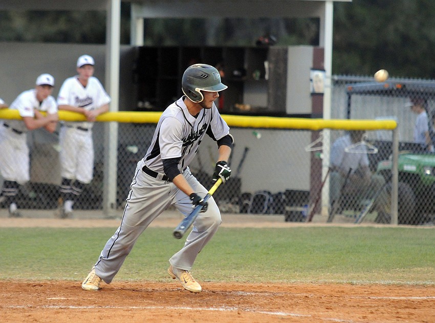 Lakewood Ranch senior outfielder Trevor Losada puts down a bunt.