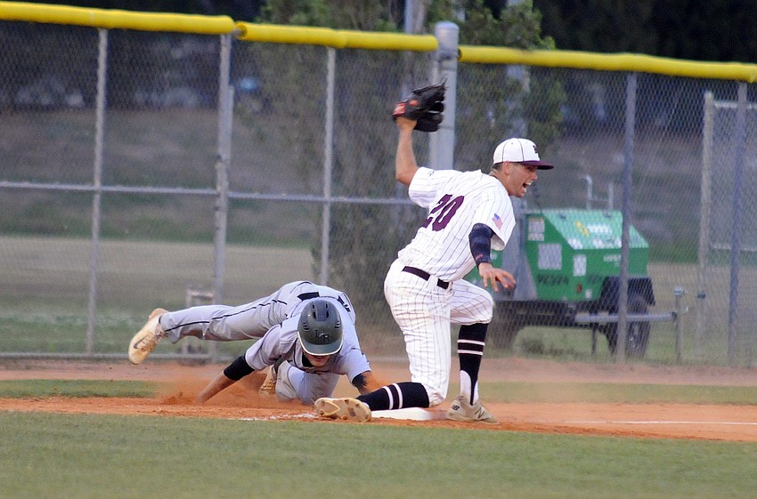 Braden River pitcher Eric Kimsey celebrates after tagging out Lakewood Ranch outfielder Trevor Losada.