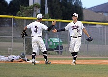 Braden River's Giancarlo Gamboa and Eric Kimsey celebrate an out.