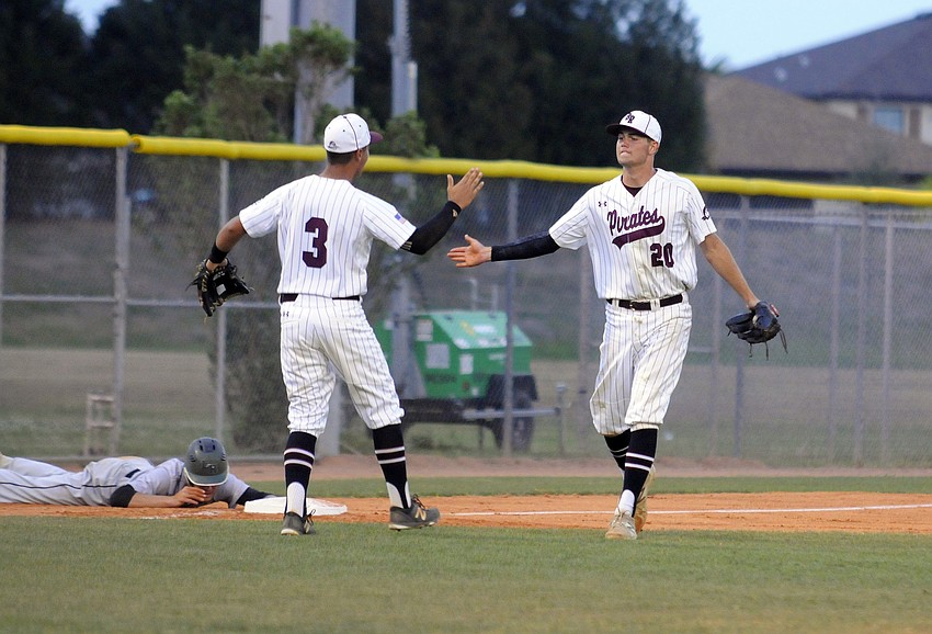 Braden River's Giancarlo Gamboa and Eric Kimsey celebrate an out.