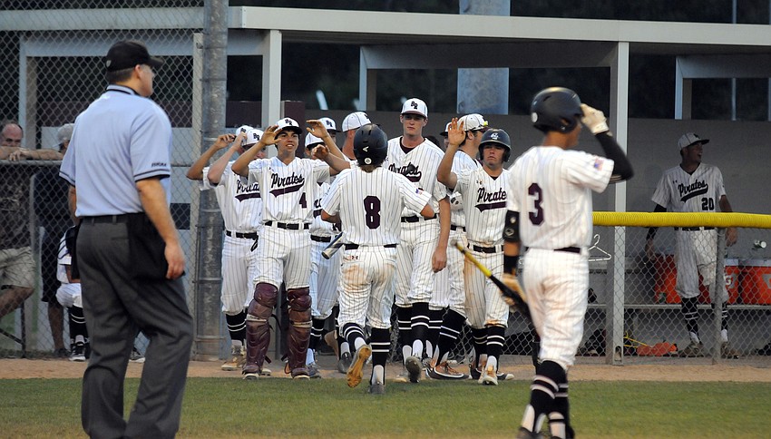 Braden River freshman Colin Goda celebrates with his teammates after scoring a run versus Lakewood Ranch.