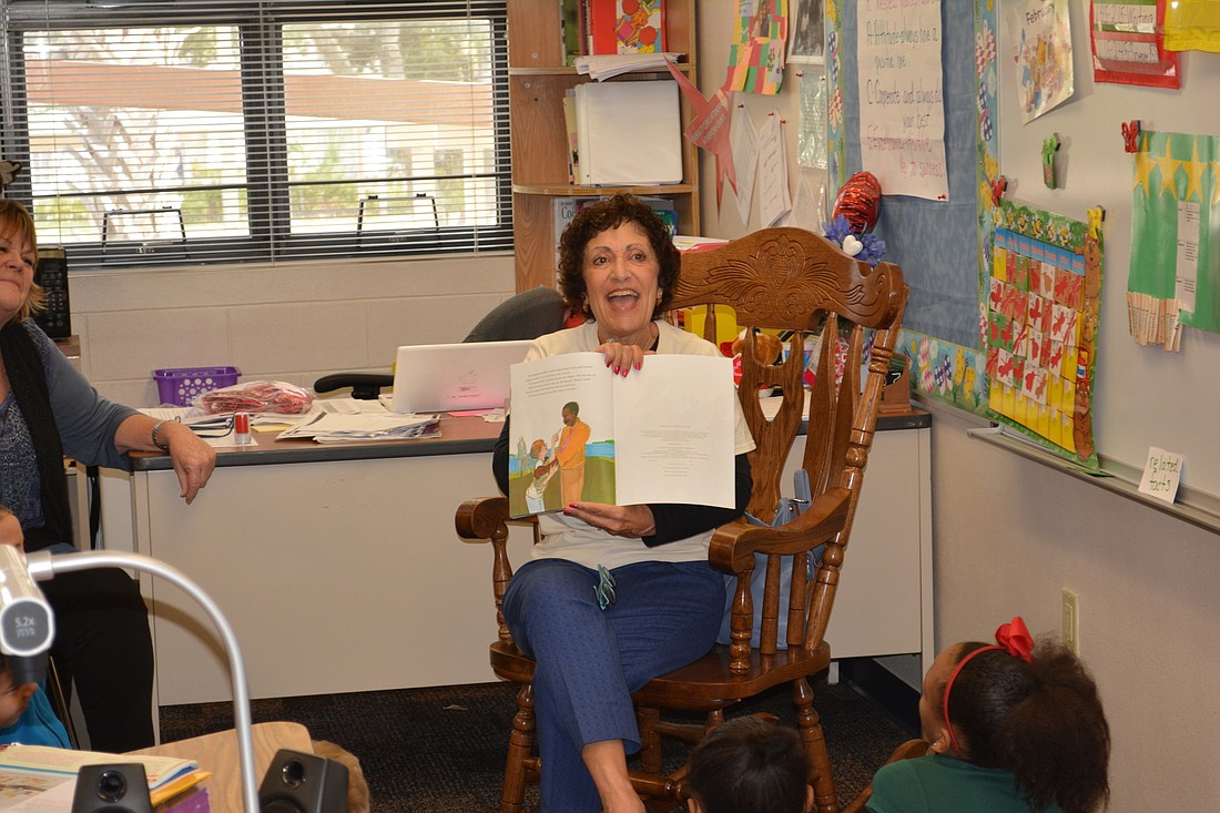 Judith Berlow, a Lakewood Ranch Rotary Club volunteer, stops during her reading period with Ballard Elementary students to discuss a topic she wants them to understand.