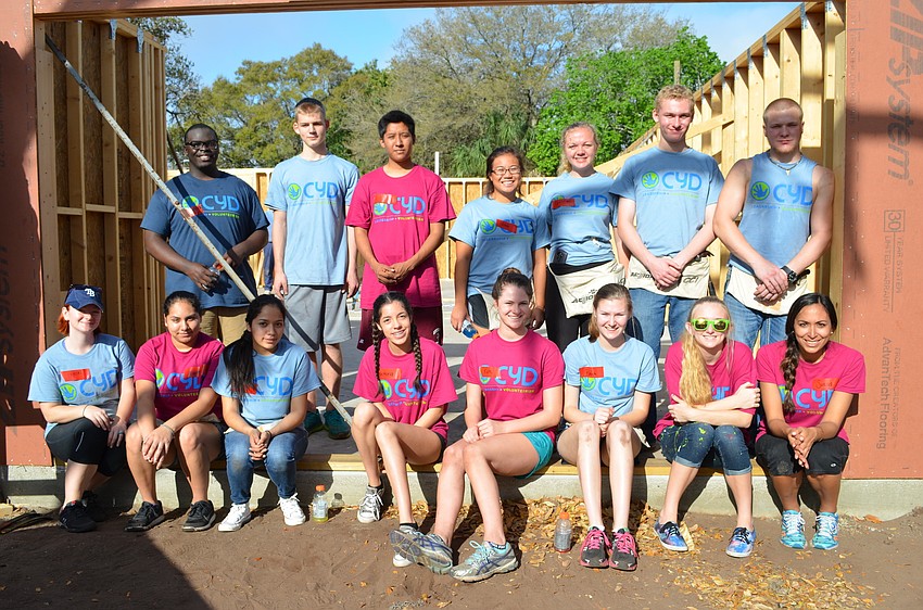 A total of fifteen students from Community Youth Development spent the early morning of their spring break to help out Habitat for Humanity.