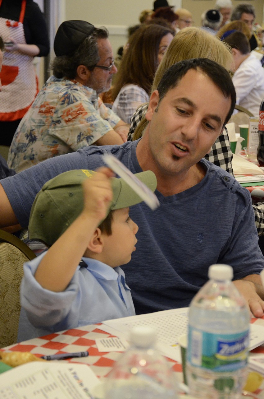 Adir and Rotem Tibi make noise during the reading of Megillah.