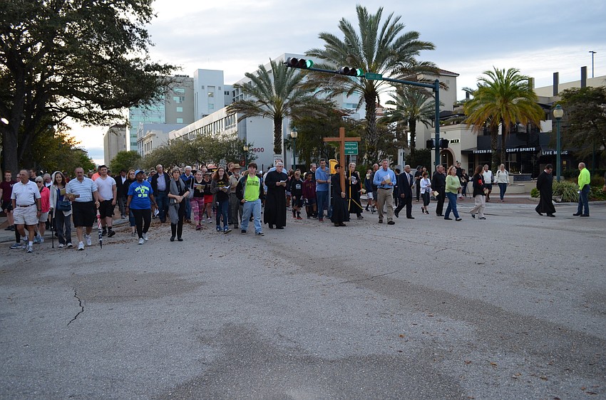 The crowd of followers grew along the route from U.S. 301 to Church of the Redeemer on Palm Avenue.