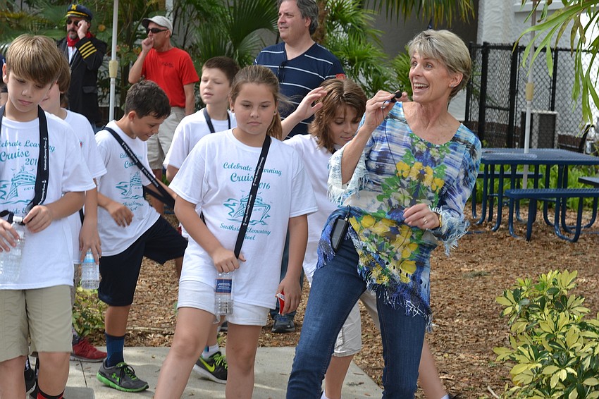 Bobbi Morgan leads students in a conga line in the courtyard at Southside Elementary School.