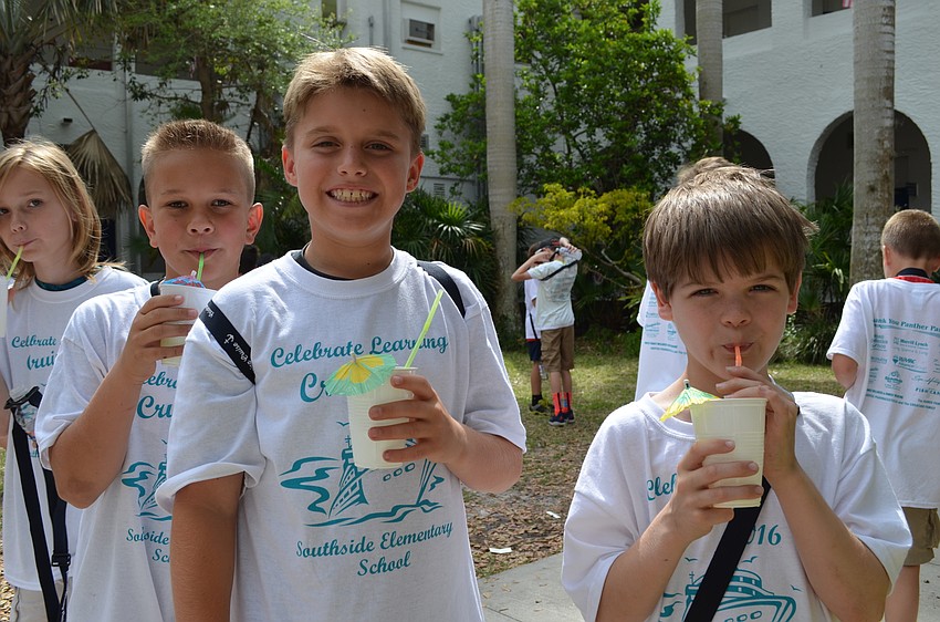 Ethan Quartermaine, Cooper Middleton and Connor Mehrtens cool down with a tropical lemonade at the Island Life station where they learned about the economies of Caribbean islands.