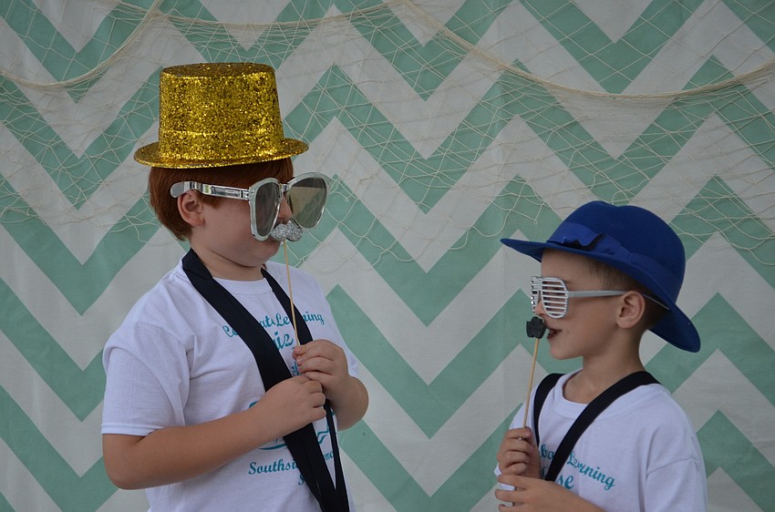 Lauden Simon and Brady Barber goof around in the photo booth.