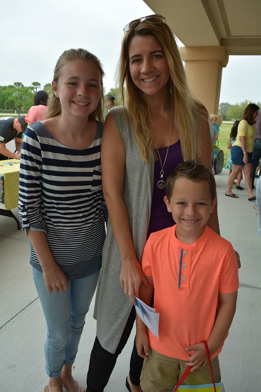 Aheyley, Regina and Gavin Peterson enjoy the morning together.