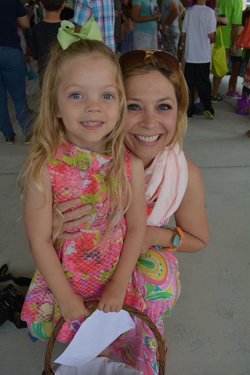 Kylie West, with her mom, Denise, wears special silver shoes with a bunny face and ears.