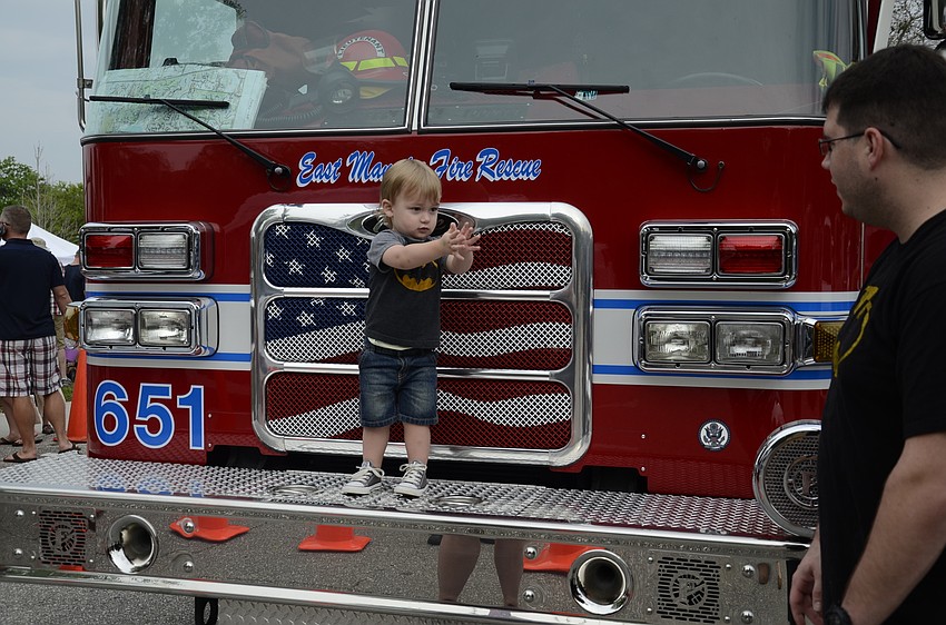 Jeremy Lebel of East County tries to get his son Landon to smile while mom Kara takes a photo.
