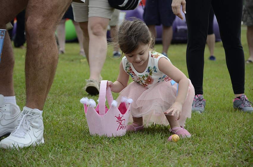 Ava Sciulara of Lakewood Ranch finds more eggs for her basket.