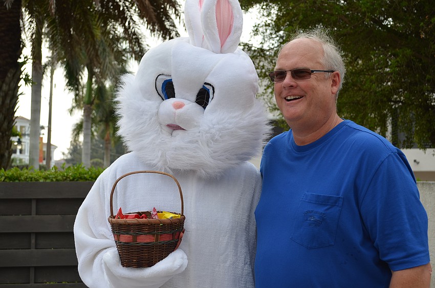 Jeff Lee wanted to pose with the Easter bunny who had the same costume that he wore for a party last year.